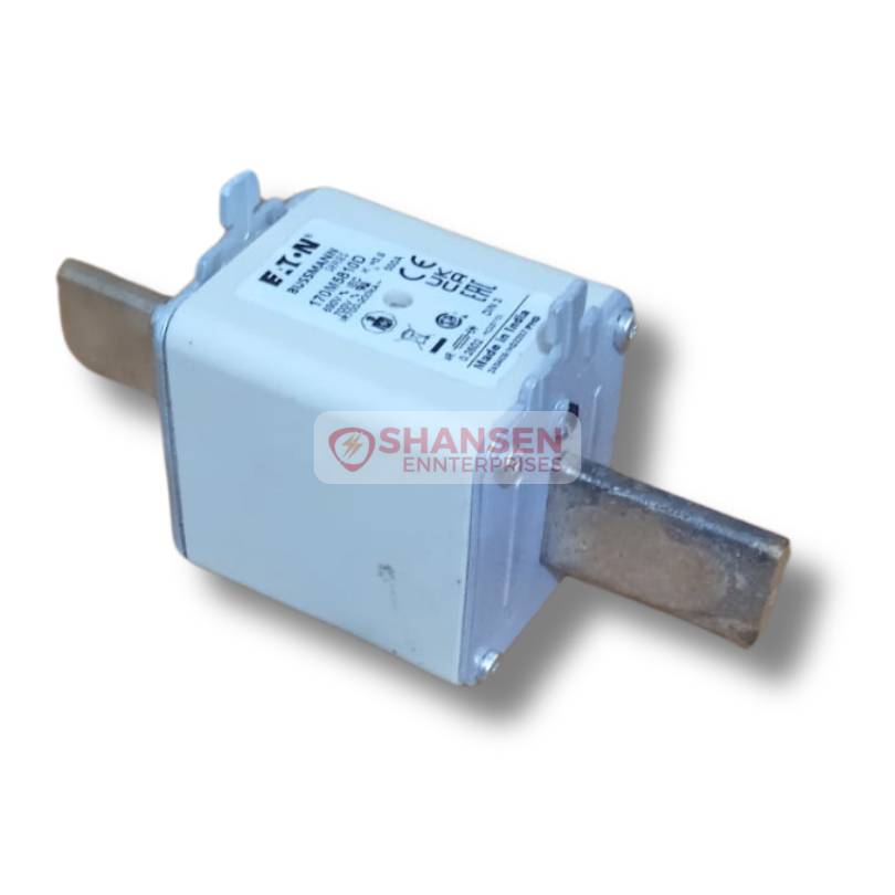 Top angle view of Eaton Bussmann Series High-Speed Square Body Fuse (Model: 170M5810D), featuring a white body with dual metal blade terminals, certification labels, and Shansen Enterprises watermark at the center